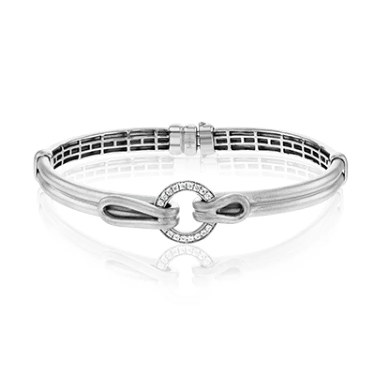 bracelets and bangles for young women -This modern men's bracelet is set with a ring of .40 ctw of white diamonds and features a distinctive brushed metal finish.