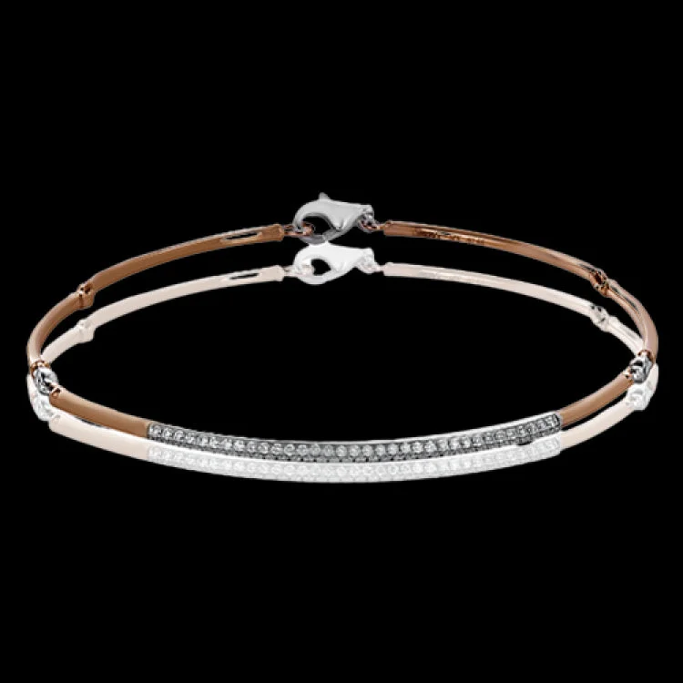 bracelets and bangles with shell design -This bracelet is perfect for layering with others, or creating a delicate statement on its own with .48 ctw of white diamonds