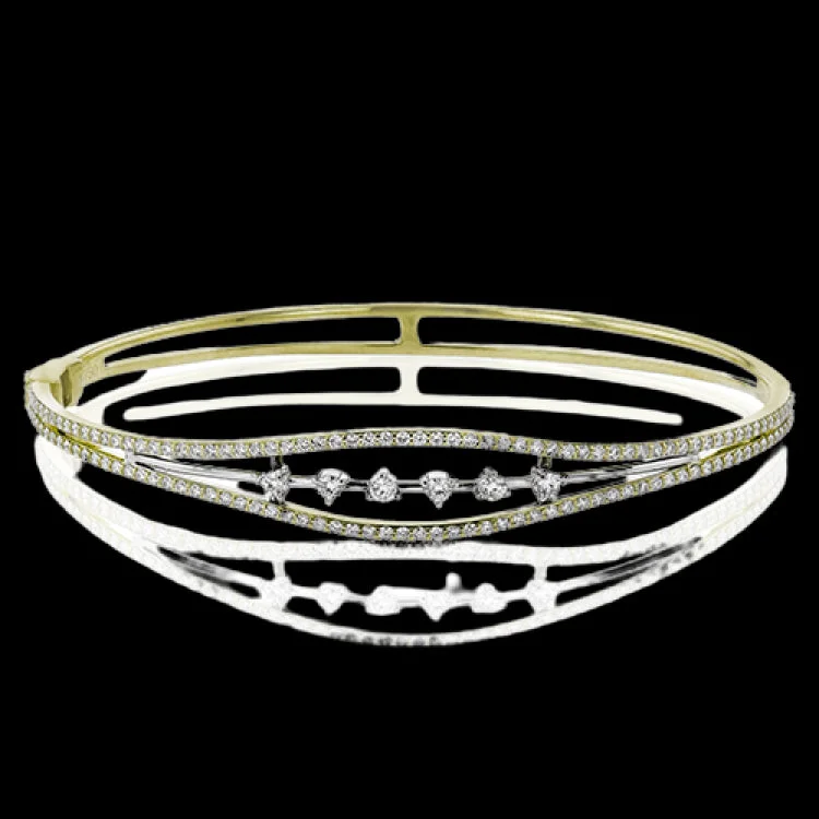 bracelets and bangles with white pearls -This bracelet brings deco style into the modern day, featuring a tapering design that is set with .72 ctw of white diamonds.