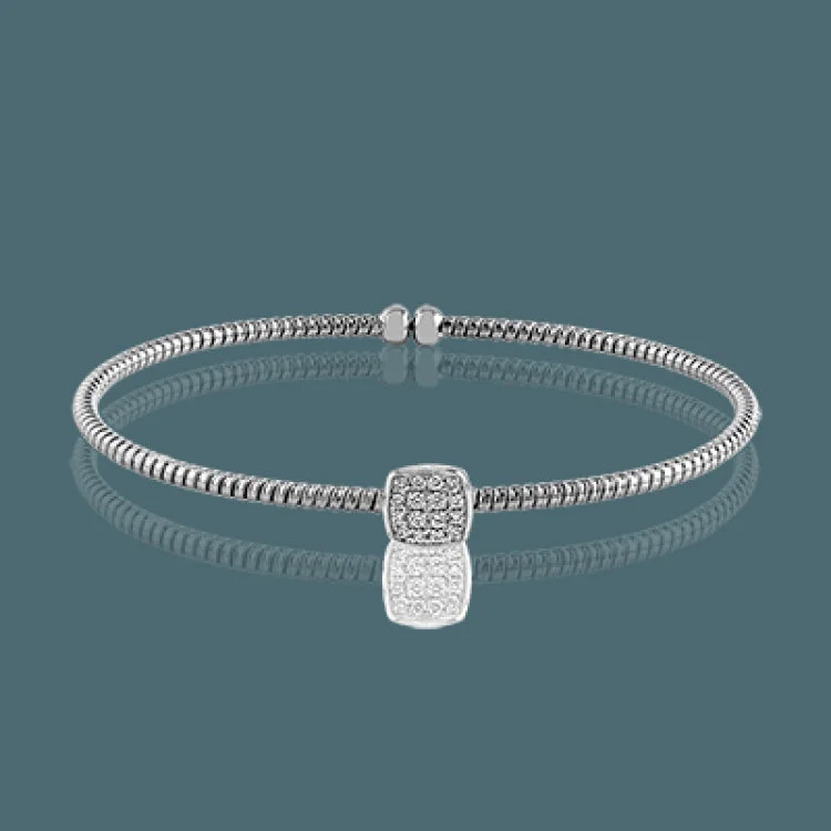 bracelets and bangles for special occasion -Featuring an elegant open design, this contemporary white gold bangle bracelet is highlighted by .16 ctw glistening white diamonds accents. Perfect for stacking.