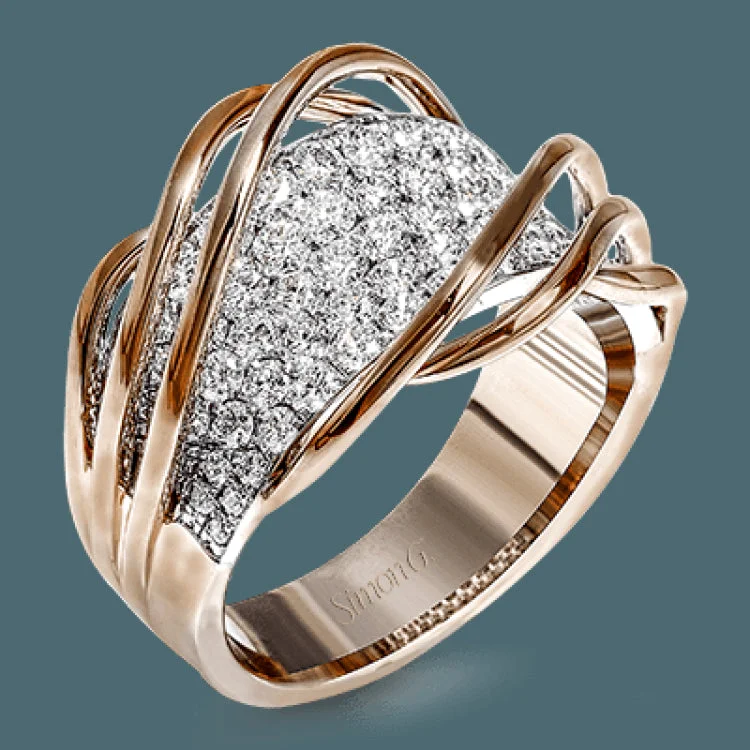 Unique women's rings for a one-of-a-kind look-This unique two-toned ring design contains 1.40 ctw of white diamonds pave set in to 18k white gold, overlaid by organic bands of 18k rose gold.