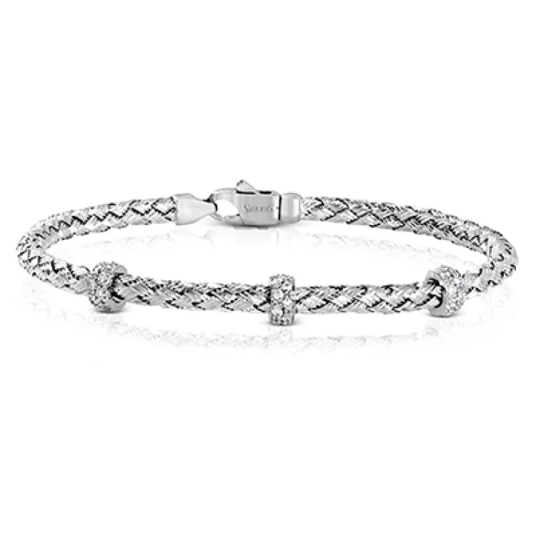 bracelets and bangles for fashion lovers -This woven 18k white gold bracelet is ideal for layering, but can also stand on its own. A total of .33 ctw of white diamonds add sparkle to this piece. Perfect for stacking.